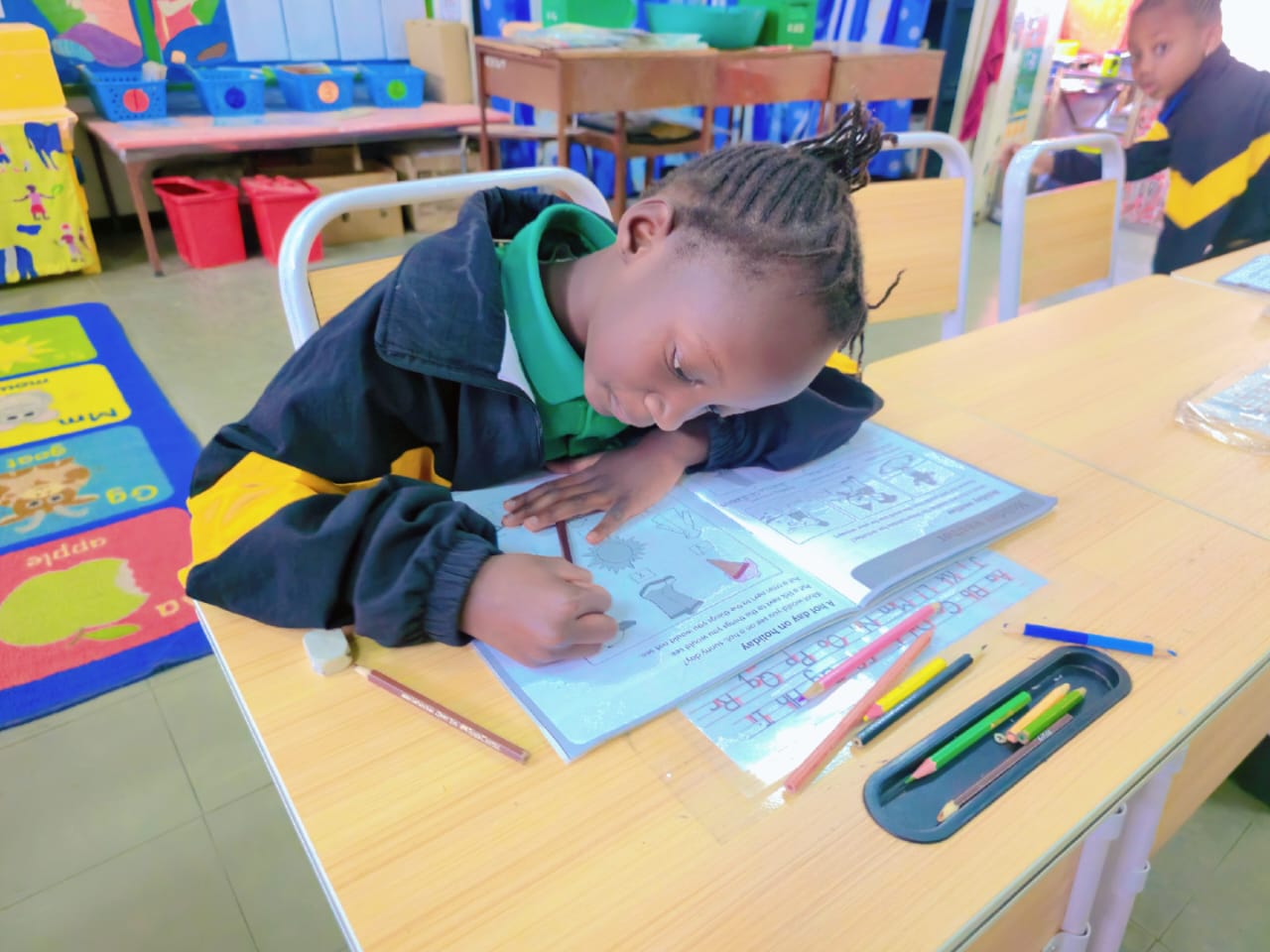 Primary pupils working in their books