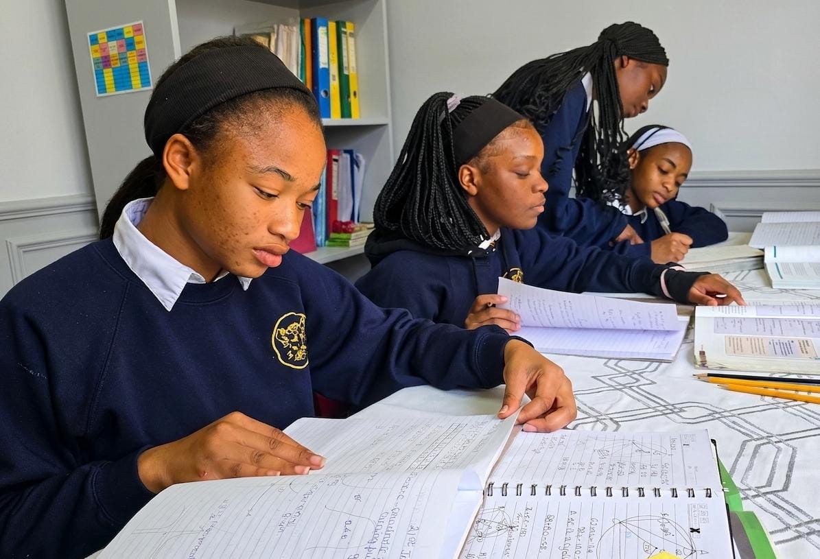 Boarders working through notes and textbooks during prep