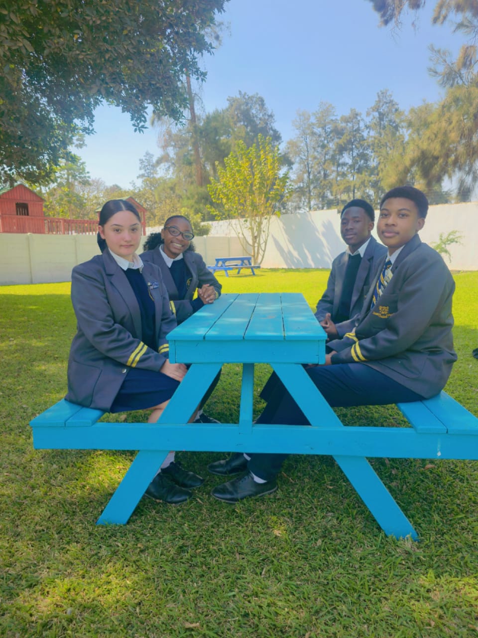 Simba secondary students together on the school grounds