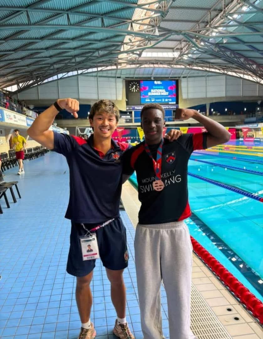 Joshua Mulenga of Simba International School with his bronze medal at the England Swimming Championships