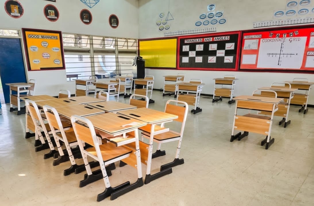 Bright primary maths classroom with modern desks